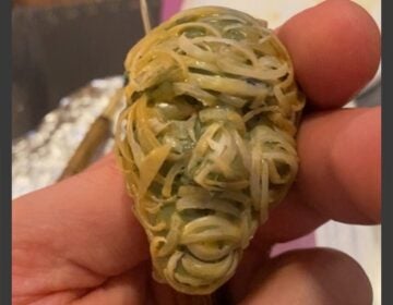 Working with nail clippings to create a replica of the FIFA World Cup trophy