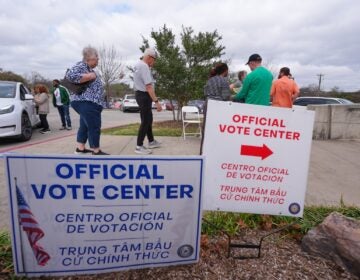 Primary voters arrive to cast ballots at an official vote center