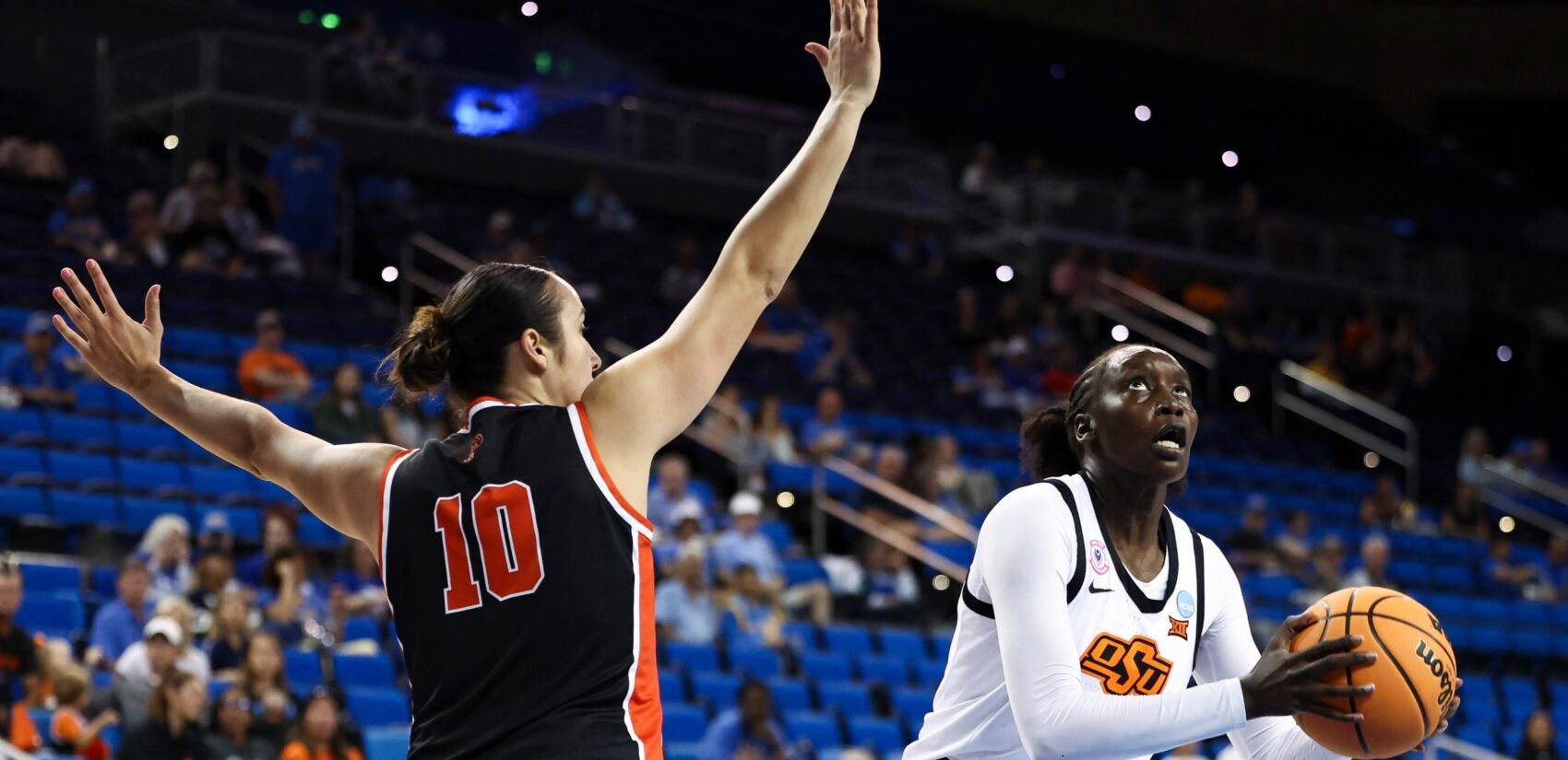 Skye Belker guards Achol Akot