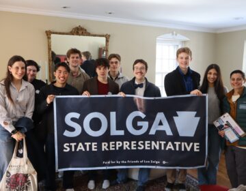 solga campaing Leo Solga and supporters holding up a large campaign poster