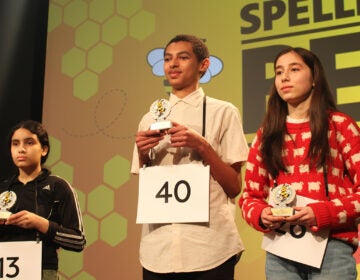 Isaac Geremew, center, an eighth grader