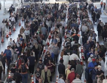 Travelers line up at a TSA checkpoint at George Bush Intercontinental Airport in Houston, Thursday, March 26, 2026.