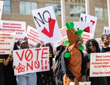 High school students holding up signs at the protest.