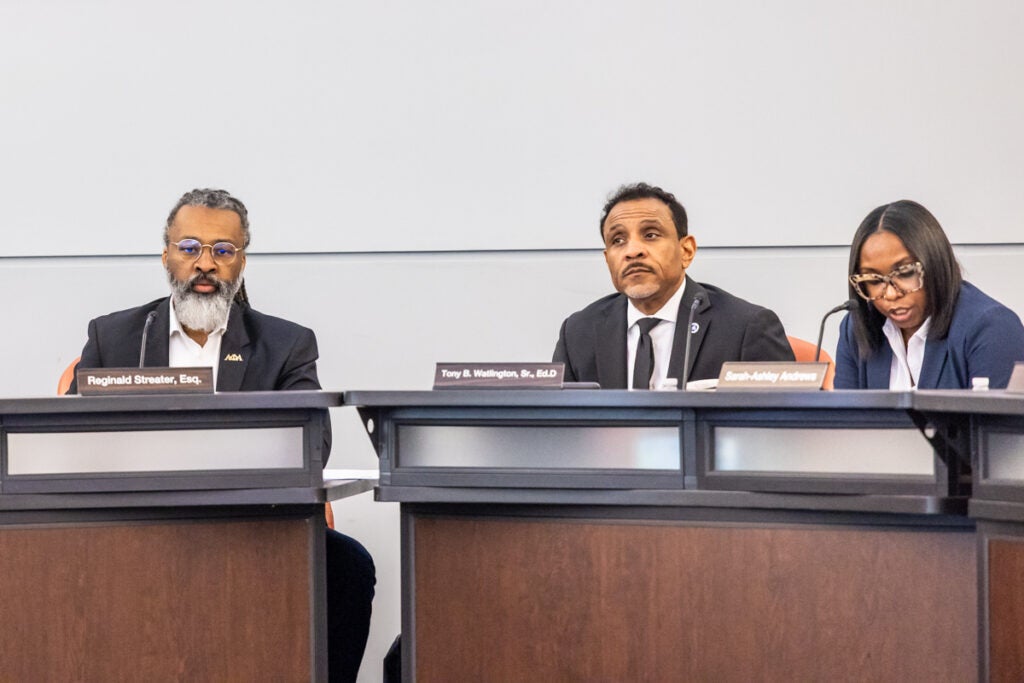 Reginald Streater, Tony Watlington and Sarah-Ashley Andrews sitting at a table