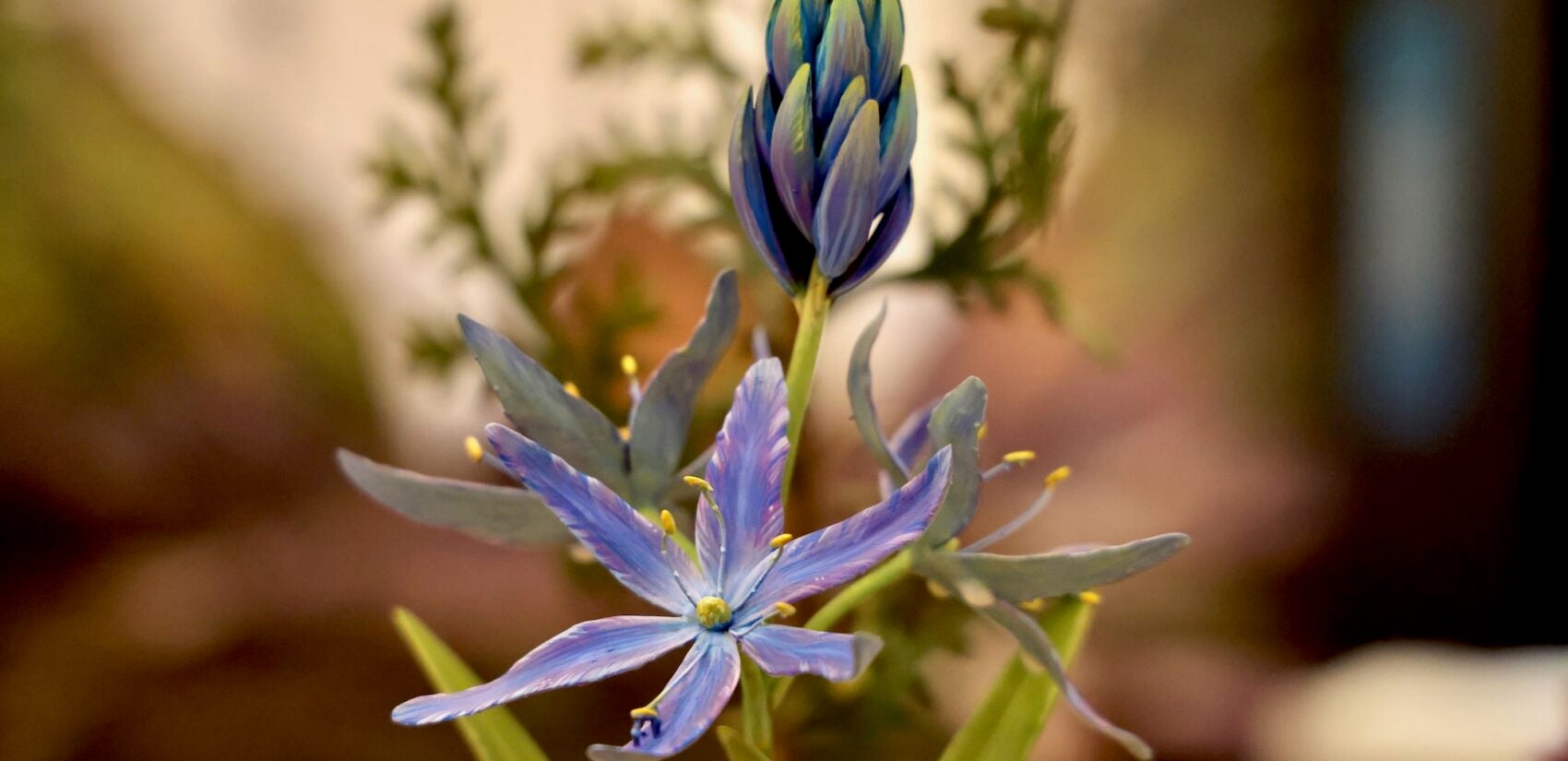 A close up view of a 3-D printd flowering plant.