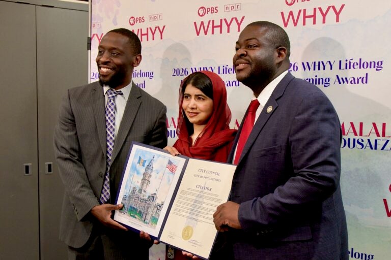 Malala Yousafzai receives a citation from Philadelphia City Councilmembers Isaiah Thomas and Anthony Phillips