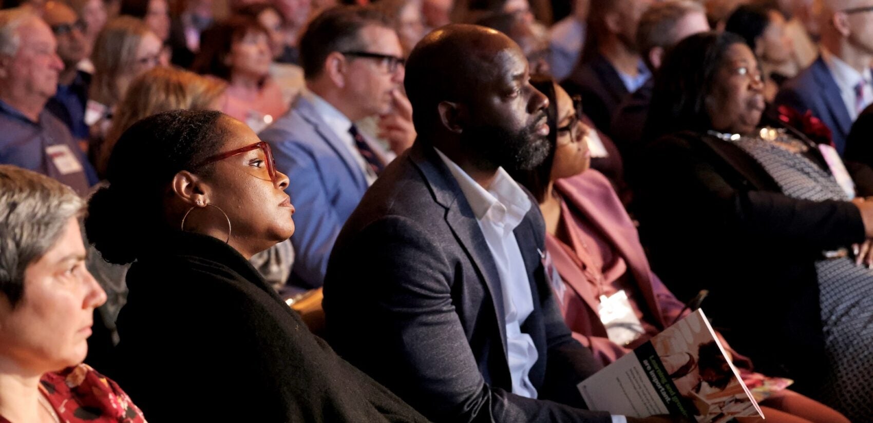 Audience members at WHYY's Lifelong Learning Award presentation listen as Terry Gross interviews the 2026 recipient, Malala Yousafzai