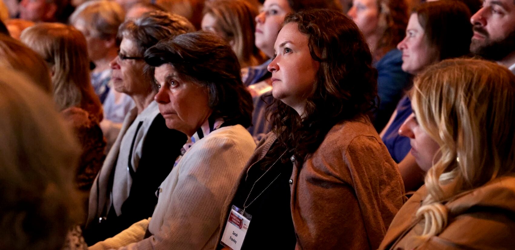 Audience members at WHYY's Lifelong Learning Award presentation listen as Terry Gross interviews the 2026 recipient, Malala Yousafzai