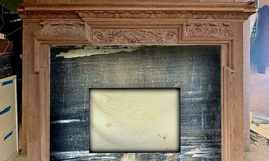 Historic marble reclaimed from the Please Touch Museum is being repurposed in a fireplace