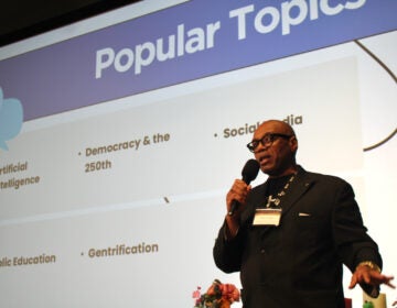 Tony Cuffie, senior manager, WHYY News Community and Engagement Team, speaks into a microphone at the WHYY Civic News Summit
