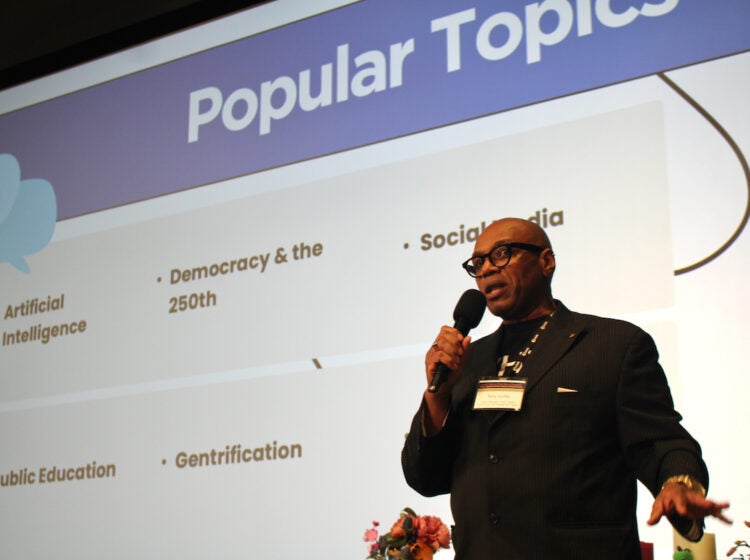 Tony Cuffie, senior manager, WHYY News Community and Engagement Team, speaks into a microphone at the WHYY Civic News Summit