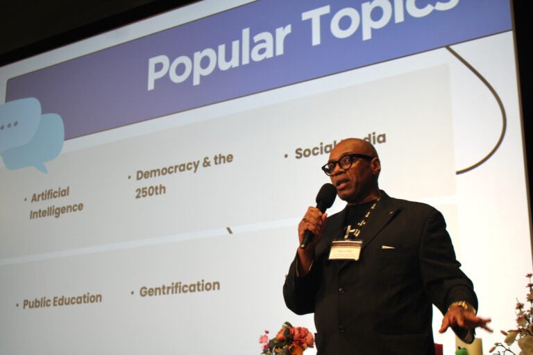 Tony Cuffie, senior manager, WHYY News Community and Engagement Team, speaks into a microphone at the WHYY Civic News Summit