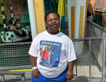 Bryan poses for a photo outdoors.