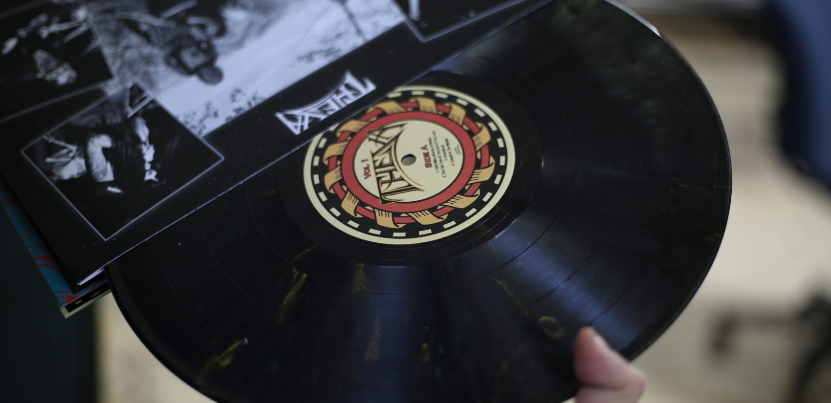 a record being pulled from a sleeve