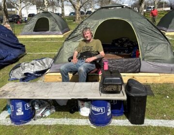 Jerry Alford looks on at a Wilmington homeless encampment