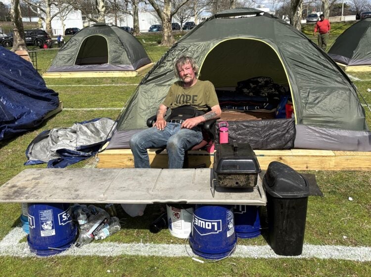 Jerry Alford looks on at a Wilmington homeless encampment
