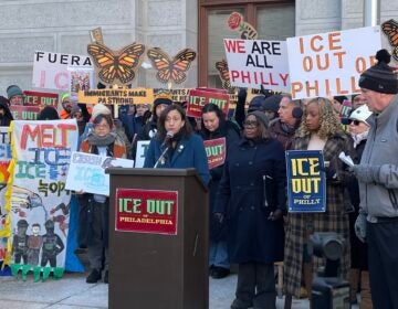 City Councilmember Rue Landau, at podium, and Councilmember Kendra Brooks