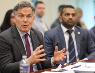 Sen. David McCormick (left) and FBI director Kash Patel