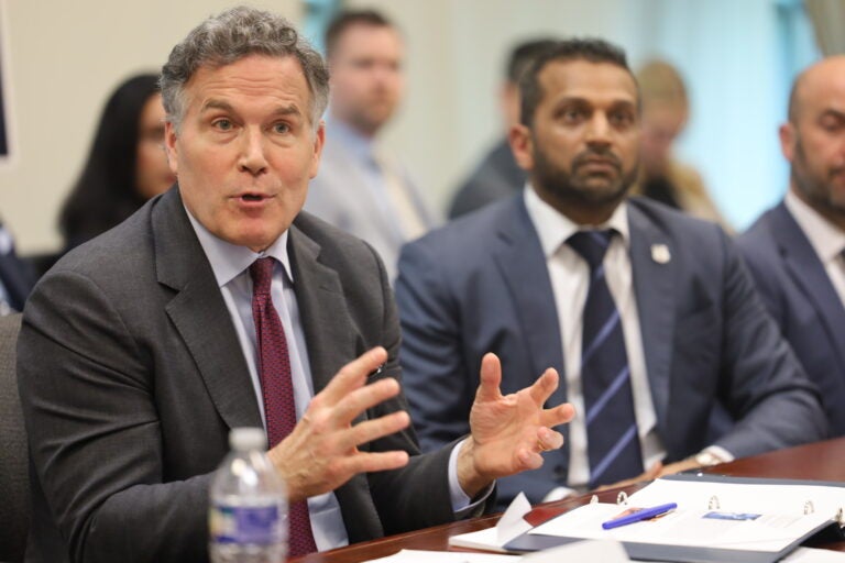 Sen. David McCormick (left) and FBI director Kash Patel