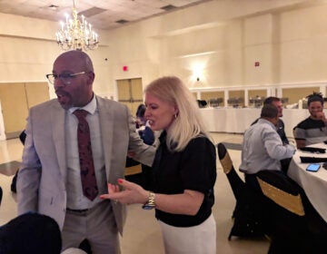 Poore and quincy allen Nicole Poore speaking with Quincy Allen during the luncheon.