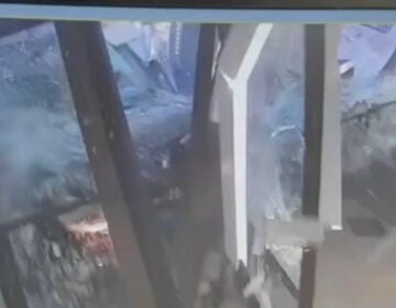 A man drives through the Philadelphia 2nd District police building