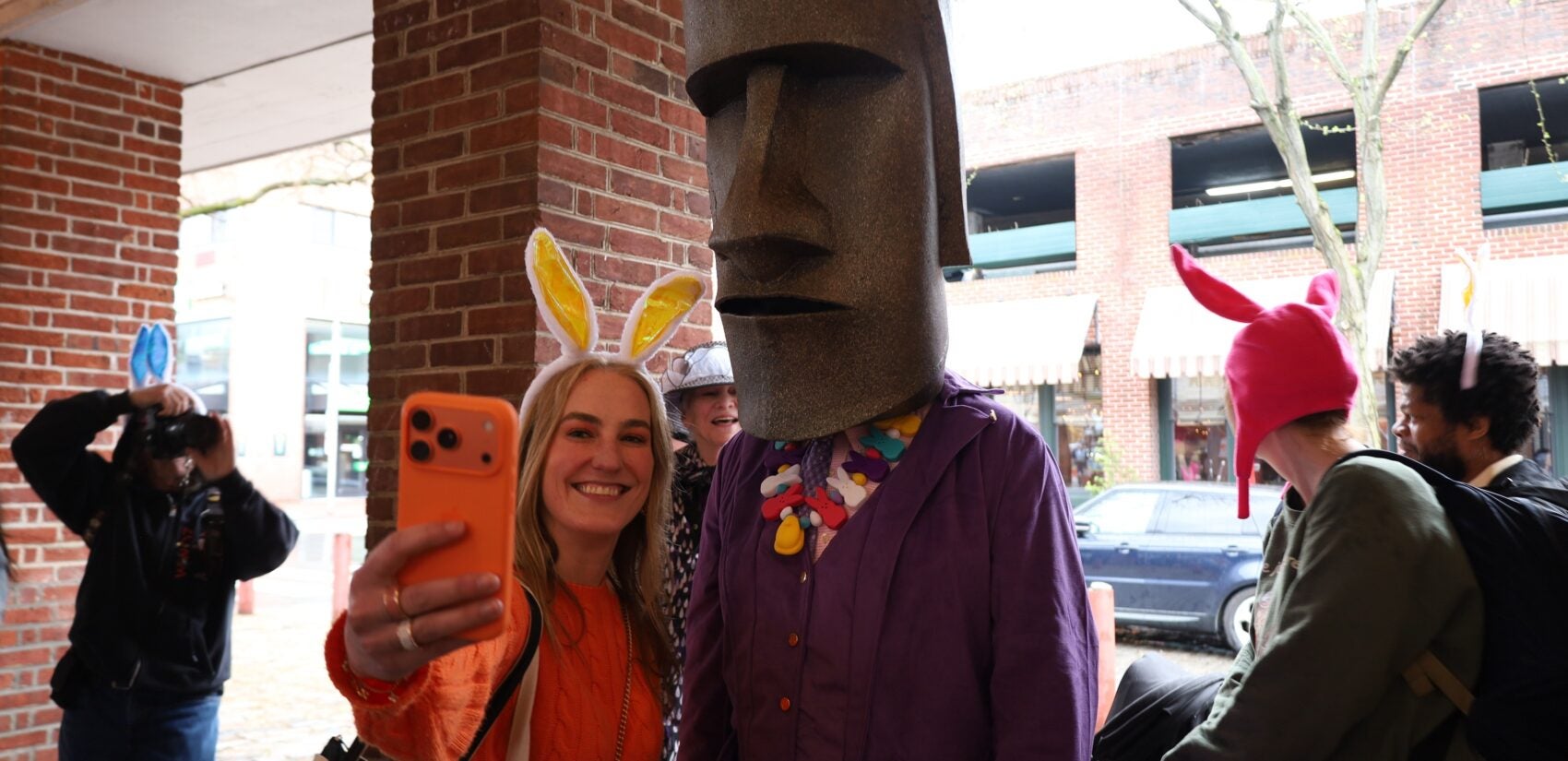 a person with an Easter Island head on