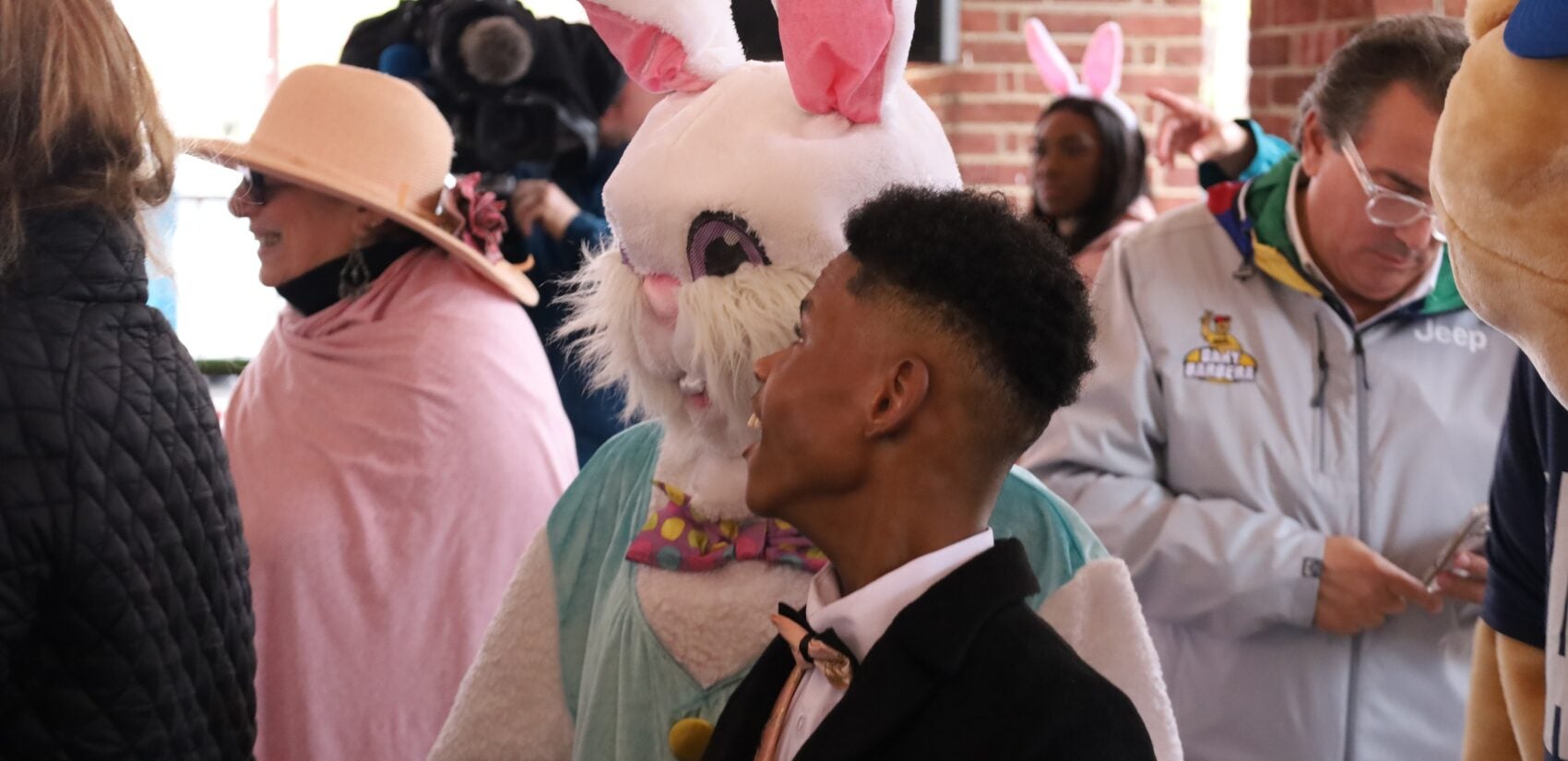 a man looks at the Easter Bunny