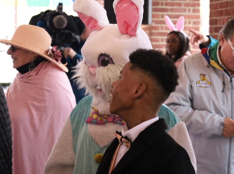 a man looks at the Easter Bunny