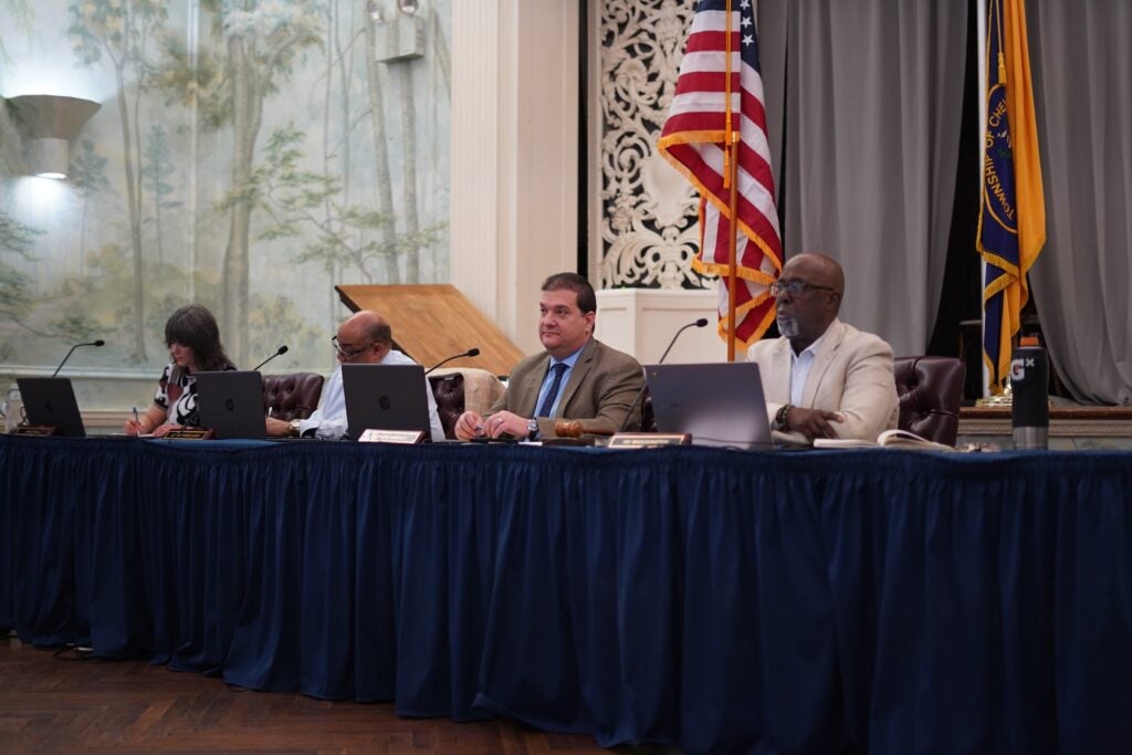 Commissioners sitting at a table taking questions from the public.