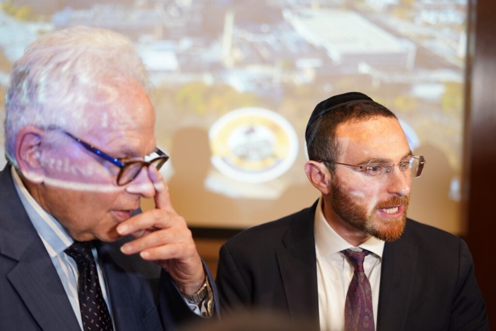 Dr. Arthur Klein (left) and Yoel Polack appear at a town hall event about the future of Crozer-Chester Medical Center, at Widener University on April 15, 2026
