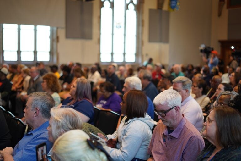 A crowd of people listen to a town hall about the future of Crozer-Chester Medical Center, at Widener University, on April 15, 2026