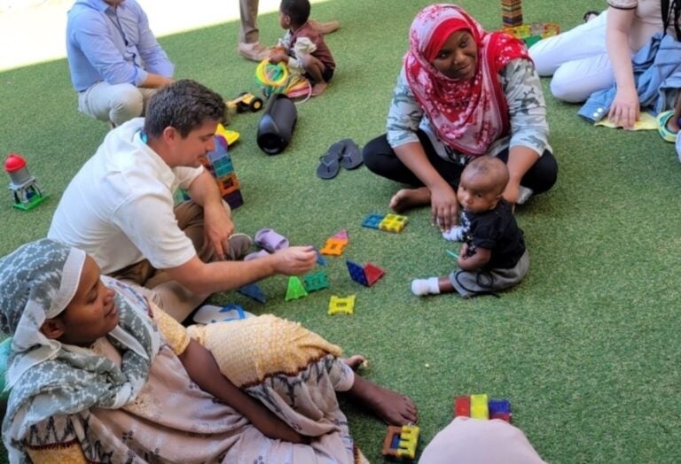 Bryan Shupe interacting with Palestinian child