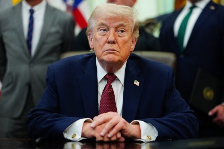 Donald Trump looks on