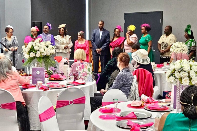 Attendees listening to a speaker at the event.