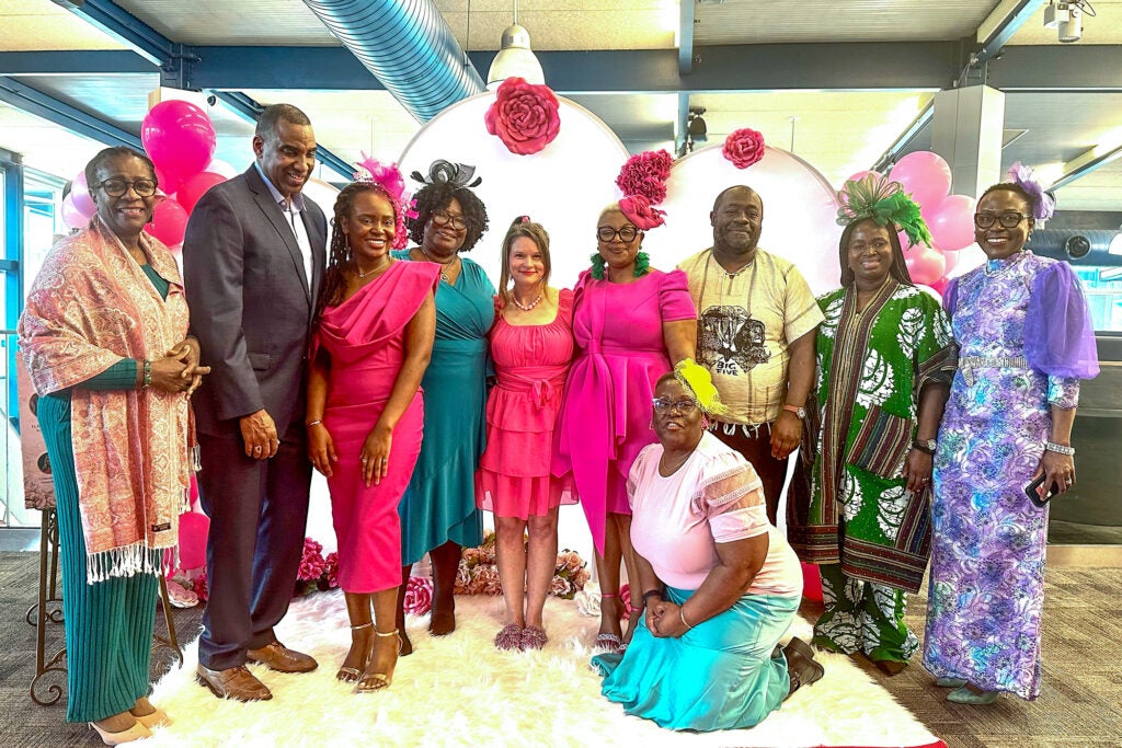 A group of people posing together for a photograph at the event.