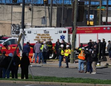 First responders gather near a partially collapsed CHOP parking garage in Grays Ferry, Philadelphia, Thursday, April 9, 2026.