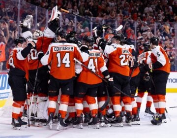 Hurricanes Flyers Hockey The Philadelphia Flyers gather around the net of goalie Dan Vladar