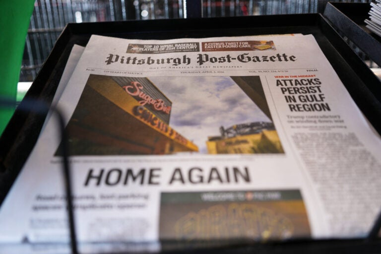 The printed edition of the Pittsburgh Post-Gazette sits in a newspaper rack