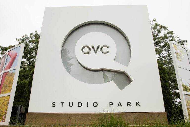 FILE - Corporate signage is shown outside a QVC facility in West Chester, Pa., Friday, July 7, 2017.   (AP Photo/Matt Rourke, File)
