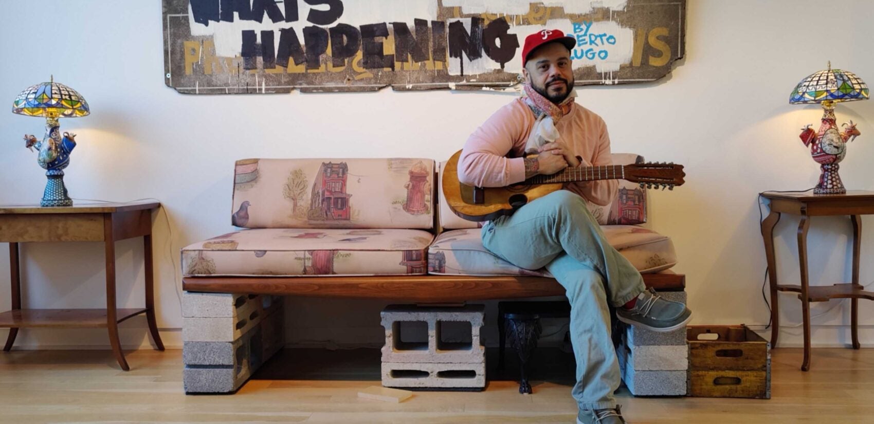 Artist Roberto Lugo sitting