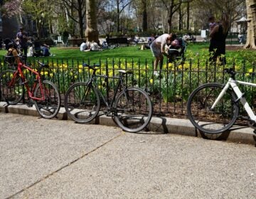 Bicycles locked up to the fences of Rittenhouse Square Park