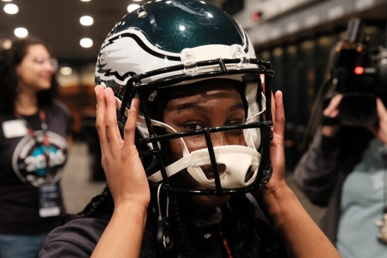 Students got to try on helmets and held other used gear