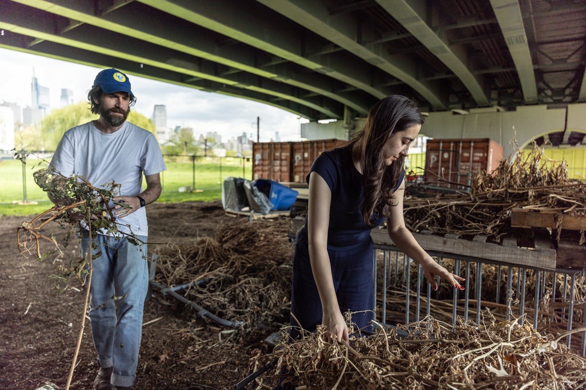 Yasaman Amirzehni and Tom Wyburn put dried material into their cart
