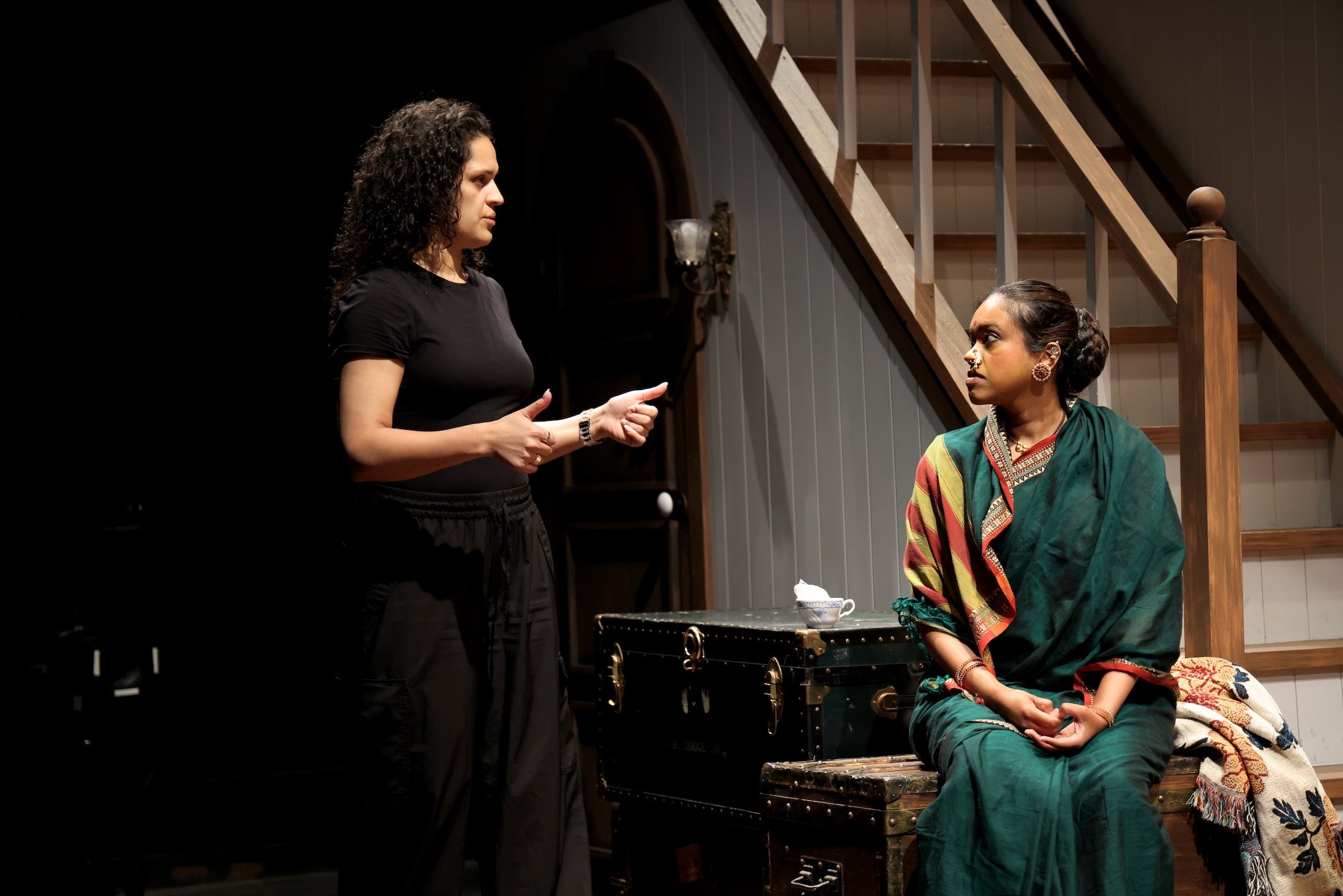 Director Melissa Crespo runs through a scene with Avanthika Srinivasan during a rehearsal