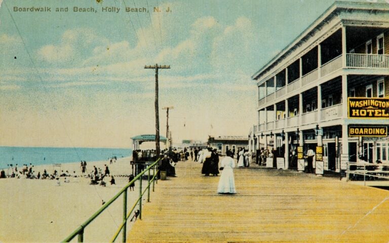 an old photo of Holly Beach and its boardwalk