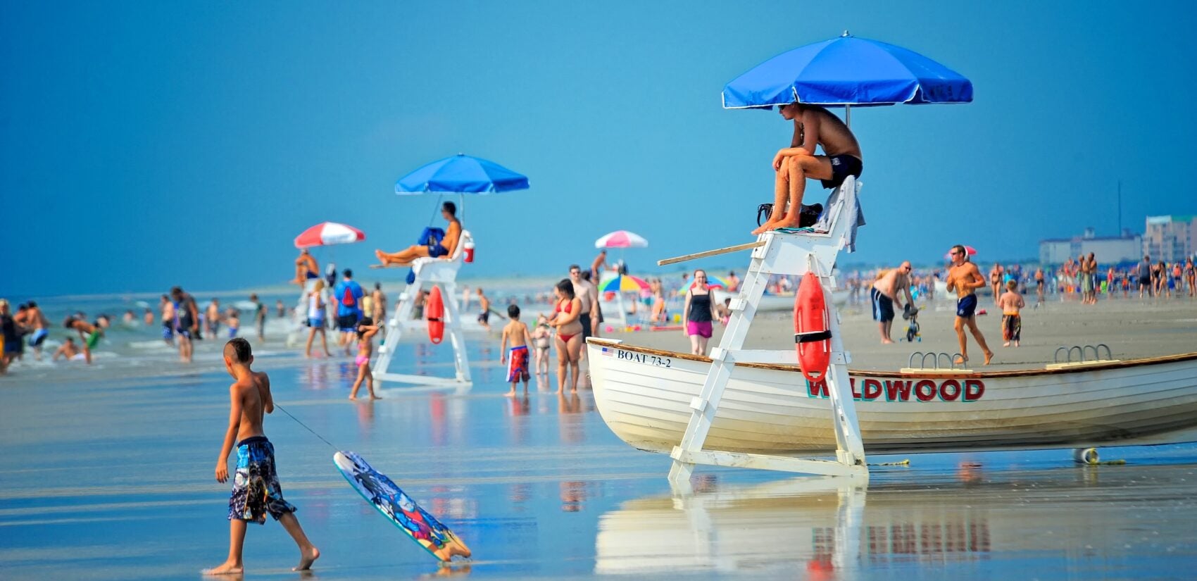 Beachgoers fill the wide beaches of Wildwood