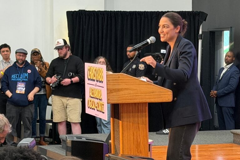 Alexandria Ocasio-Cortez speaks to a crowd