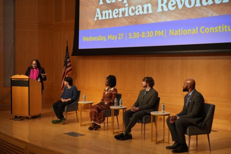 Moderator Sarah Glover (far left) and panelists from left, Sophia Gala, Maya Izzard, Tristan Worsham and Leon Smith discuss the impact of the American Revolution, representation and youth voices as America is set to celebrate the Semiquincentennial on July 4, 2026. (Joe Kaczmarek for WHYY News)
