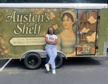 austens-shelf Charity Herndon smiles in front of the Austen's Shelf book trailer