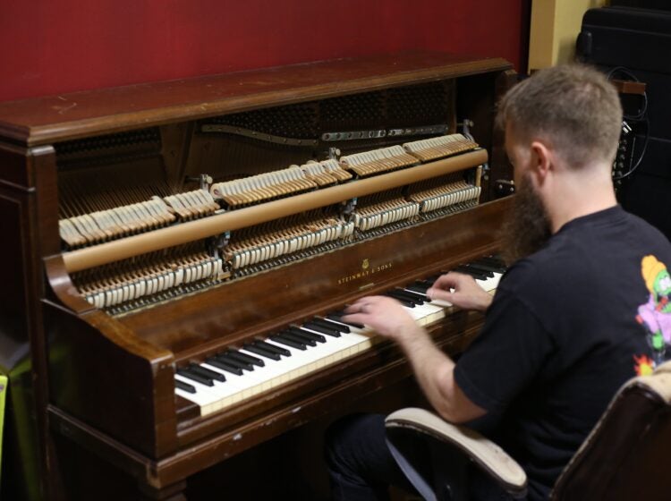 Corey Bernhard playing piano
